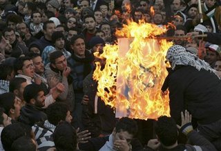 Jordanian MPs and protestors burning the Israeli flag