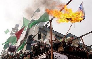 Afghan demonstrators burn an Israeli flag outside a Mosque in Kabul